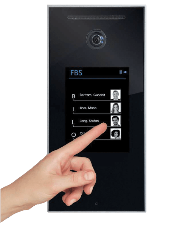 A photo of someone’s hand touching the screen of an FBS Authenticator device.