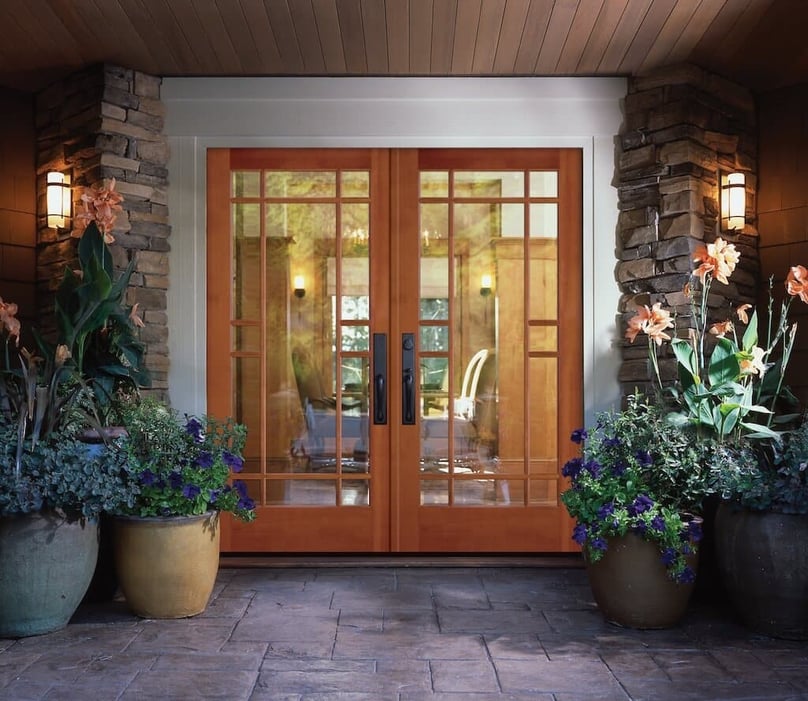  A photo of a set of double security doors dressed with wood and security glass.