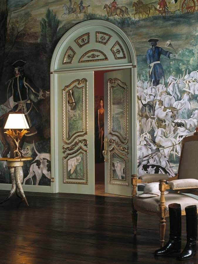 A photo of an ornate master bedroom door in a luxury home.