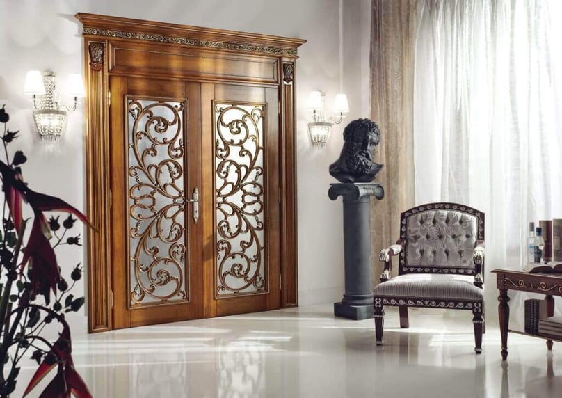 A photo of a master bedroom French-style door.