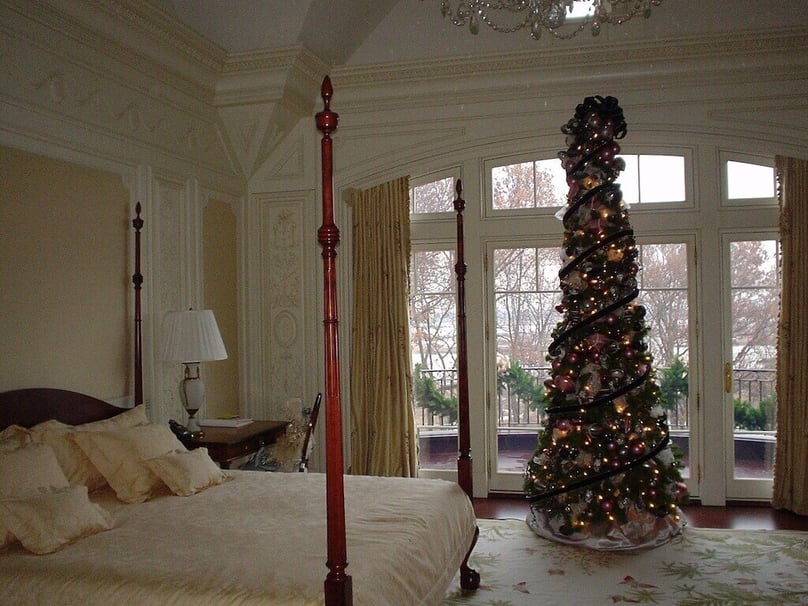 A photo of large security windows in the master bedroom of a luxury home.