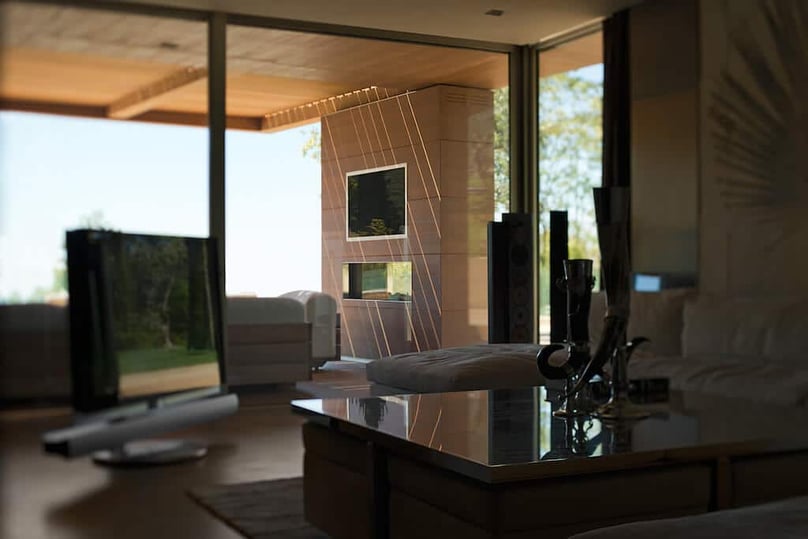 A photo of large fixed windows looking out over a luxury patio. 