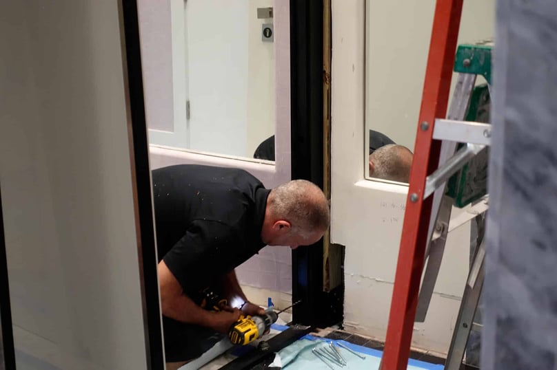A photo of a professional security door installer