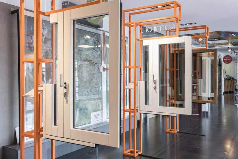 A photo of home security windows hanging on display in the showroom.