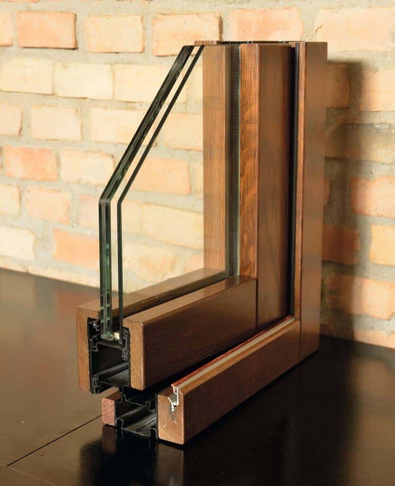 A close-up photo of an FBS high security window with a wood finish.